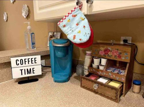 a trash can sitting on a counter with a coffee time sign at Luxury Miami 2br Townhouse Near Stadium !! in Miami Gardens
