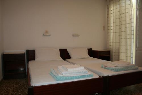 Säng eller sängar i ett rum på Korali Hotel
