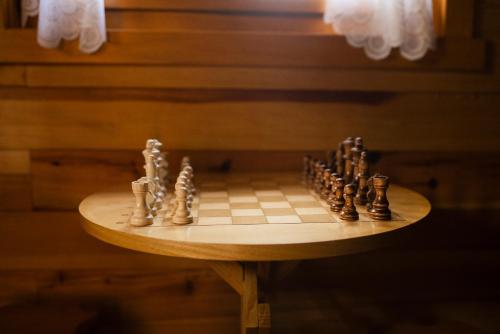a chess board on a table in a room at Rajska koliba in Kaludjerske Bare