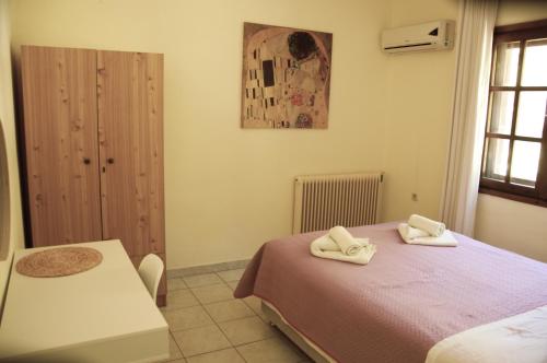 Postel nebo postele na pokoji v ubytování Pension Nikos