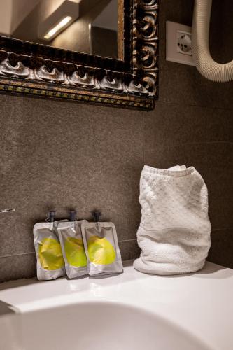 a bathroom with a sink with a towel and a towel at Alla Marina Affittacamere in Riomaggiore