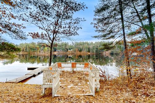 a wooden dock in front of a lake at Crescent Corner in Waterboro