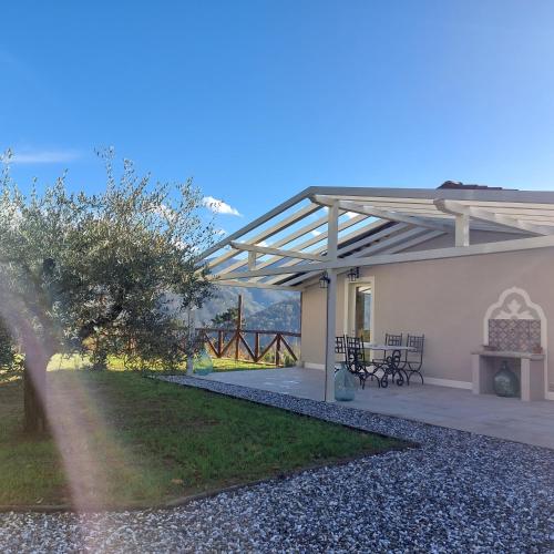 a view of a house with a patio at Agriturismo Tenuta La Fratta in Bagni di Lucca