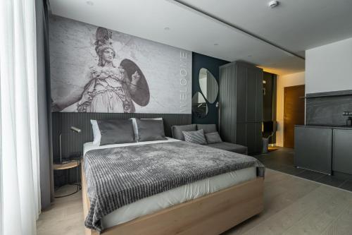 a bedroom with a bed and a painting on the wall at Marrilux apartments Residence Hill in Kopaonik