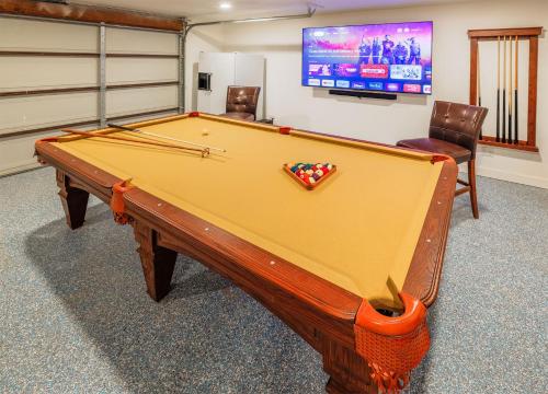 a pool table in a room with a tv at New: Dome, Hot Tub, Game Room, 5 min to park in Joshua Tree