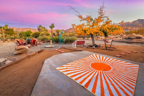 an umbrella sitting on top of a dirt road at New: Dome, Hot Tub, Game Room, 5 min to park in Joshua Tree