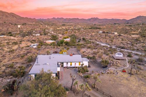 an aerial view of a house in the desert at New: Dome, Hot Tub, Game Room, 5 min to park in Joshua Tree