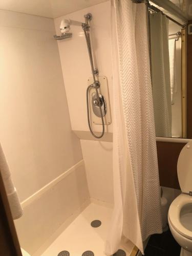 a bathroom with a shower and a toilet at Luxury Afloat Yacht Paradise 3 bedrooms 3bath 5 beds with full Marina view in Los Angeles