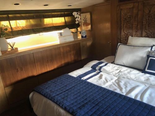 a bedroom with a bed on a boat at Luxury Afloat Yacht Paradise 3 bedrooms 3bath 5 beds with full Marina view in Los Angeles