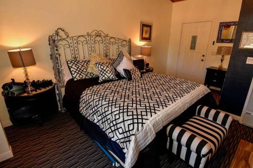 a bedroom with a bed with a black and white comforter at Black Forest Lodge in Big Bear Lake
