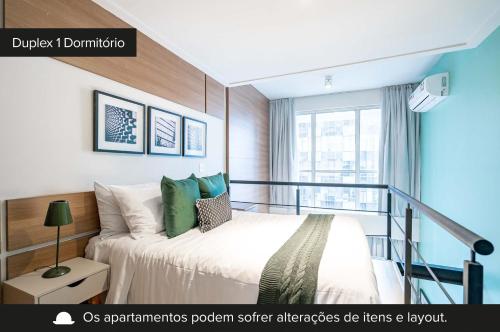 a bedroom with a bed and a balcony at Charlie NYC Berrini in Sao Paulo