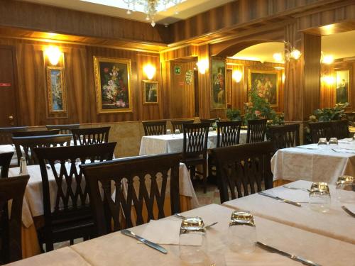 a dining room with tables and chairs in a restaurant at Antico Panada in Venice