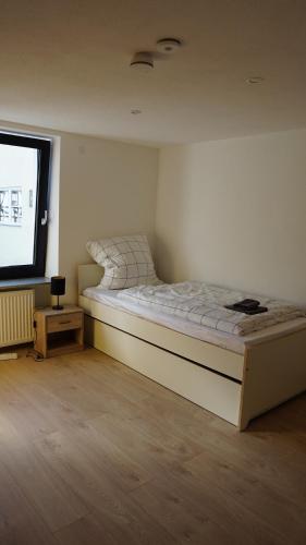 Voodi või voodid majutusasutuse Wunderschöne renovierte Wohnung in Schwäbisch Gmünd toas