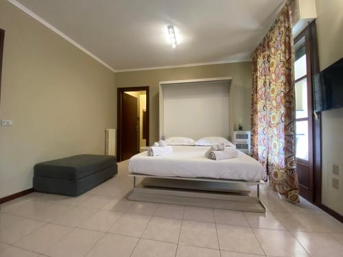 מיטה או מיטות בחדר ב-Chicco Apartment light