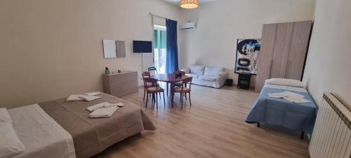 En eller flere senge i et værelse på Keira house Napoli