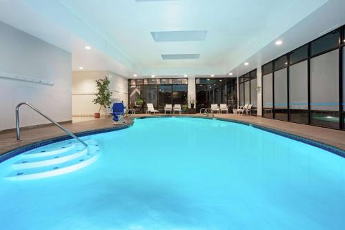 a large swimming pool in a hotel room at Woodmen Inn in Colorado Springs