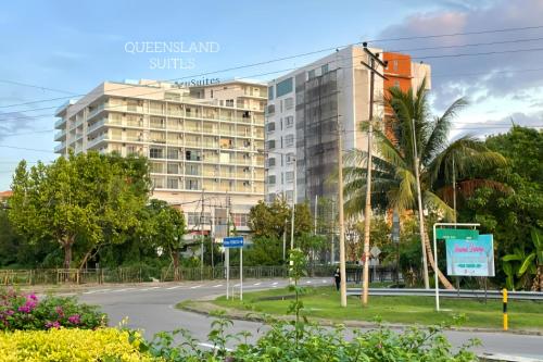 a view of a building from the street at QUEENSLAND SUITES at Aru Suites, Kota Kinabalu in Kota Kinabalu