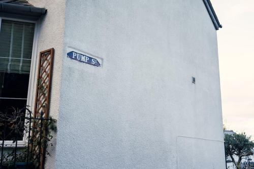 a street sign on the side of a building at Cosy hillside cottage in Great Malvern