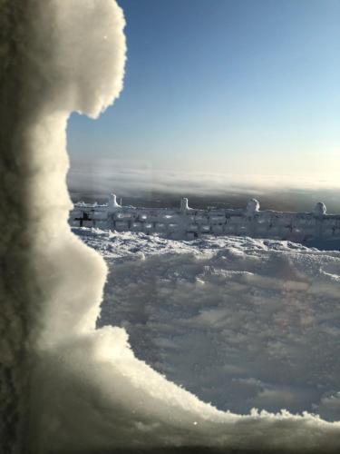 a view from a window of a snow covered field at Villa Havu holiday home in Pyhä/Lapland in Pyhätunturi