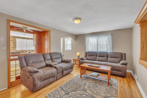 a living room with a couch and a table at Downtown 2 story property apts in Spearfish