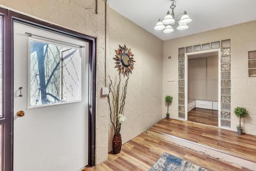 an empty room with a door and a window at Downtown 2 story property apts in Spearfish