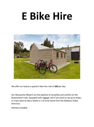 a page of a flyer with two bikes parked in front of a building at Historical Hicks Cottage in Queenstown