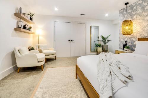 a bedroom with a bed and a living room at Ellum House in Dallas