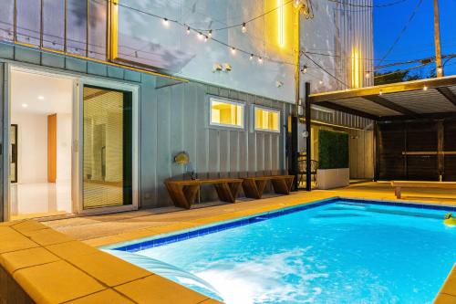 a swimming pool in the backyard of a house at Ellum House in Dallas