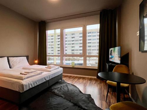 Postel nebo postele na pokoji v ubytování N8 ROOMS - by Leipzig Suites