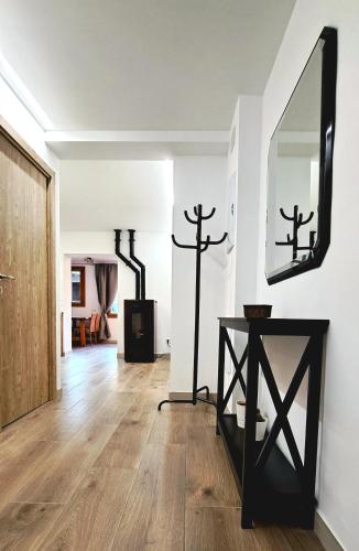 a living room with a mirror and a table at Cal Bardillo in Bagá