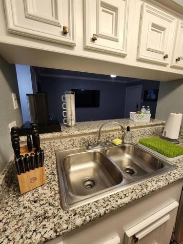a kitchen counter with a stainless steel sink at Blue Shark *E4* @ Midtown Comfortable 1BR King Apartment in Houston