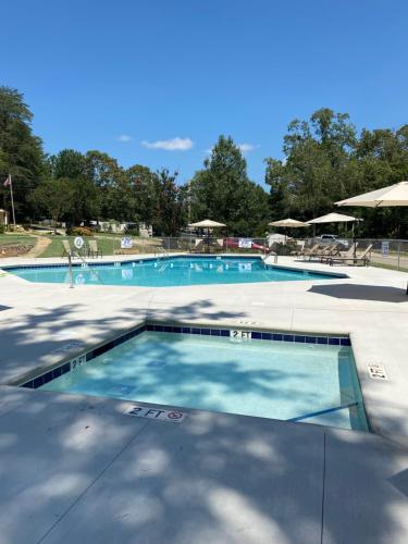 a large swimming pool with blue water at The Point RV in Townville
