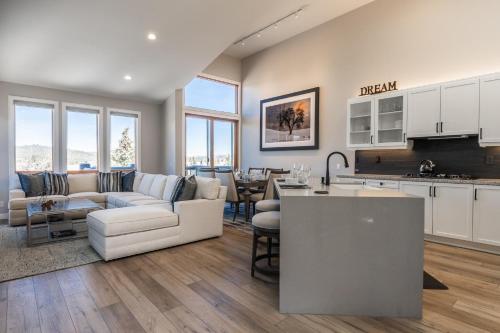 a living room and kitchen with a couch and a table at Snowcreek V 972 in Mammoth Lakes