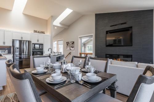 a dining room and kitchen with a table and chairs at Snowcreek V 972 in Mammoth Lakes