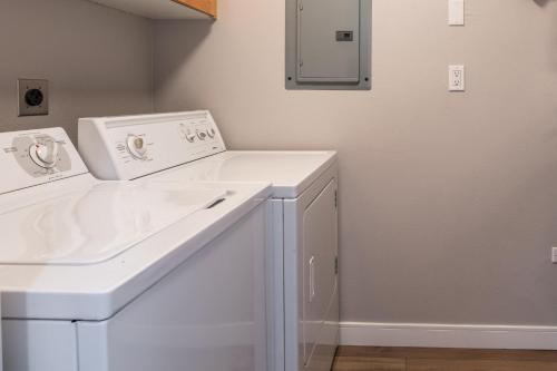 a white laundry room with a washer and dryer at Snowcreek V 972 in Mammoth Lakes