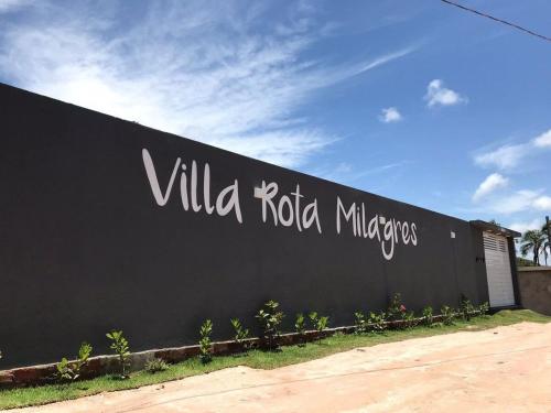 a black wall with the words villa ricotta millimeters on it at Suíte villa rota milagres, aconchegante & completa in São Miguel dos Milagres