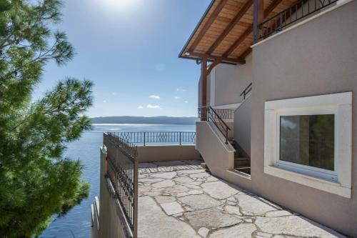 a balcony of a house with a view of the water at Villa Jana in Marusici 
