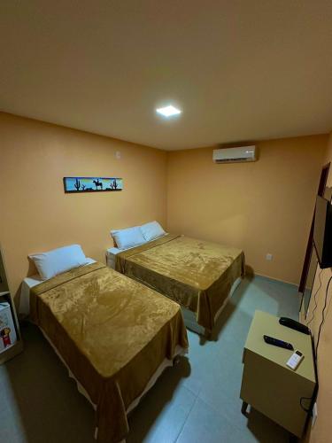 Posteľ alebo postele v izbe v ubytovaní Pousada Trilha dos Canions