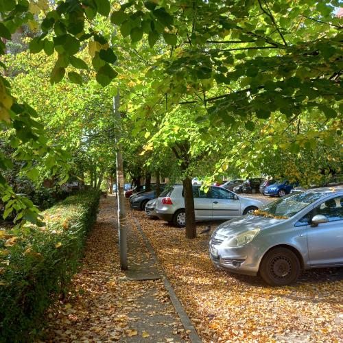 a row of cars parked in a parking lot at RIVIJERA GREEN in Belgrade