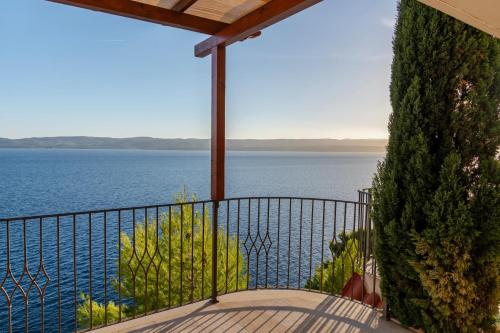 a balcony with a view of the water at Villa Jana in Marusici 
