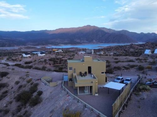 an aerial view of a house in the middle of a desert at Villamagna, casa en Potrerillos in Potrerillos