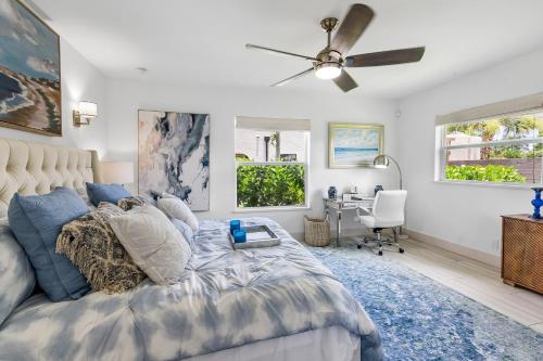 a bedroom with a bed and a ceiling fan at Elegant 3BR w Pool Near Downtown WPB in West Palm Beach