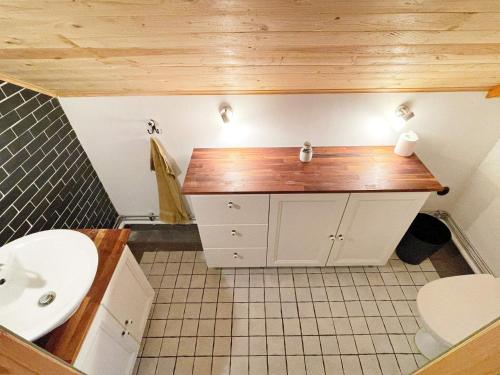 a bathroom with a sink and a toilet at 4 star holiday home in YNGSJÖ-By Traum in Yngsjö