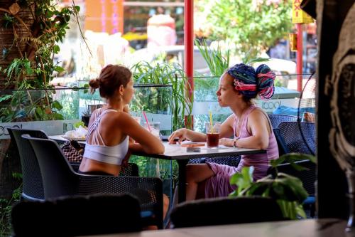 two women sitting at a table in a restaurant at Comfort Suites in Alanya