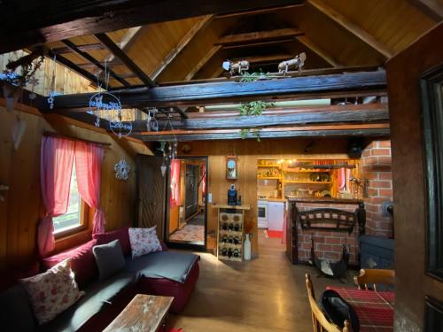 a living room with a couch and a fireplace at M&M Kuća za odmor in Vrbovec