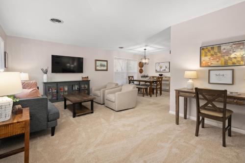 a living room with a couch and a table at Salisbury Cottage in Salisbury