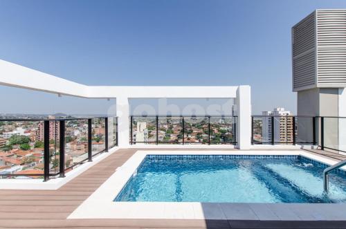 a swimming pool on the balcony of a building at Luxurious Apartment With Two Bedrooms in Asuncion