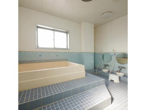 Кровать или кровати в номере Zentsuji Grand Hotel - Vacation STAY 16629v