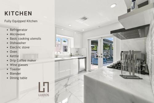 a kitchen with white counters and white appliances at Miami House with Hot Pool-spa & Pool table L48 in Hialeah
