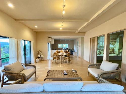 a living room with a couch and a table at Yoronto - Vacation STAY 18850v in Yoron
